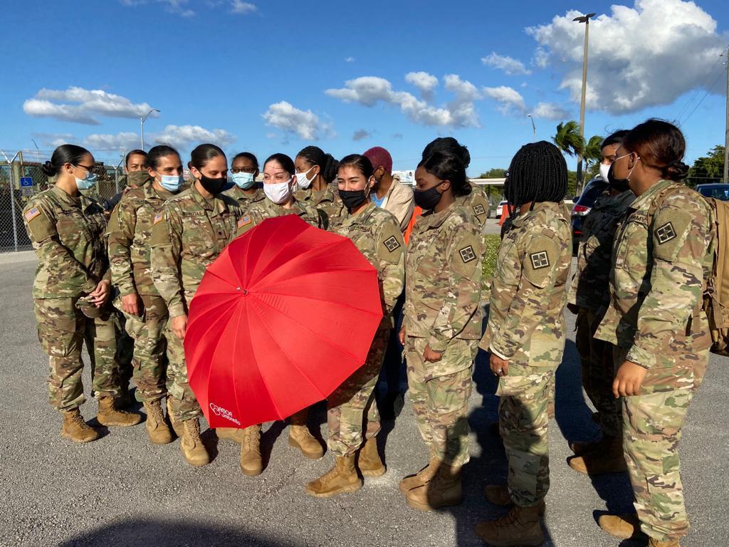 Women veterans gathering for the umbrella signature initiative