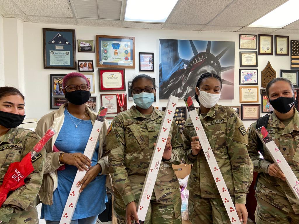 Army Unit Gathering for Care Package Signatures
